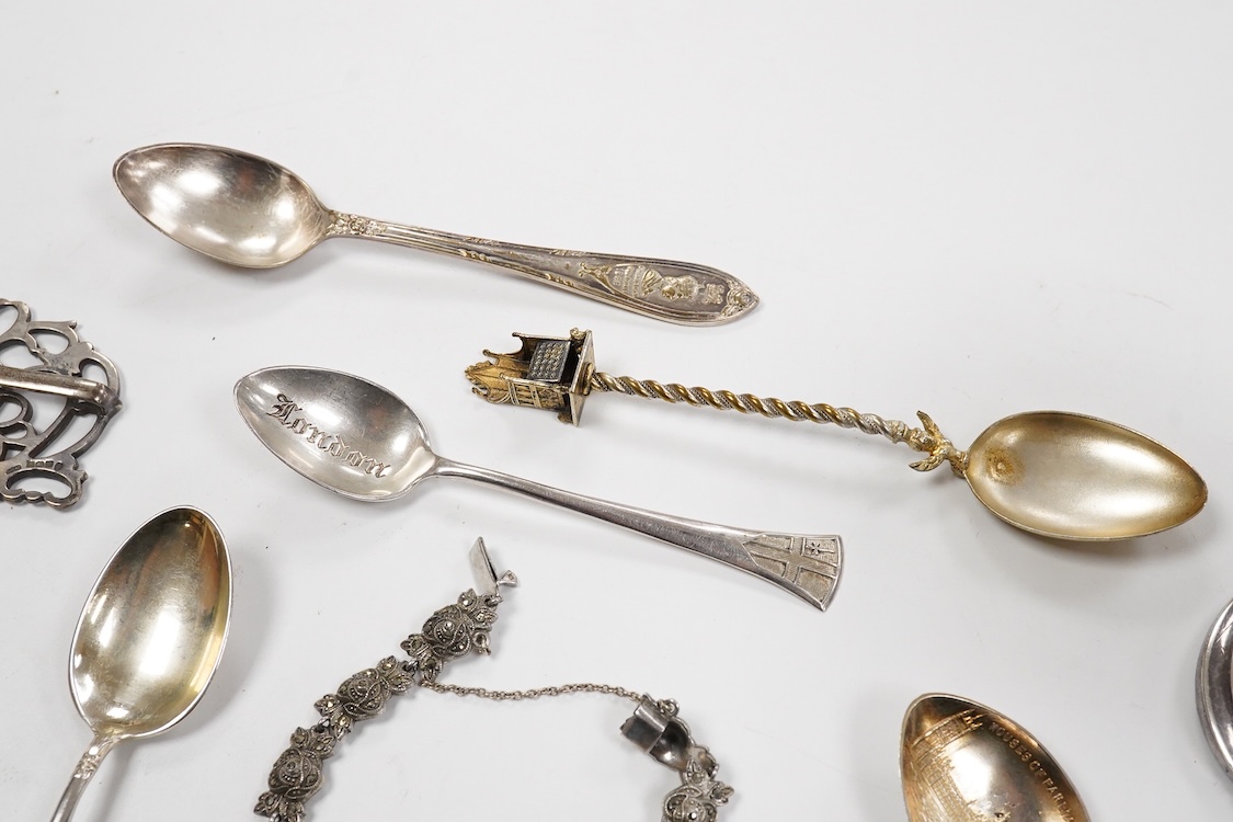 A small group of silver including an Edwardian miniature model of a throne by Edward Foligne Braham, Birmingham, 1901, 50mm, a small comport, one part of a belt buckle and three commemorative spoons, together with a gilt